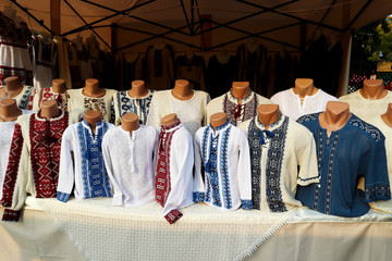 Fototapeta premium Fair in Odessa. Showcase with Ukrainian embroidered shirts.