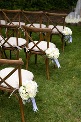 Bouquet hanging on a row of chairs