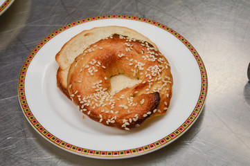 sesame seed bagel on plate