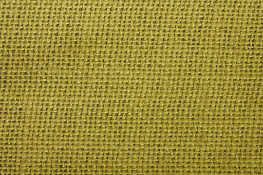 In a macro view, detail of a green burlap or woven twine material is shown up close. The hue can be easily edited if another color is desired.