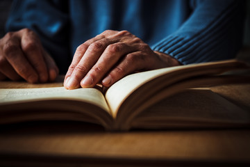 Hands and book