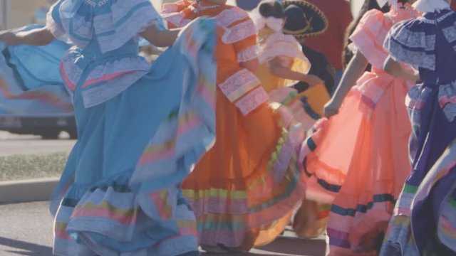 Traditional Spanish dancers dance in a parade