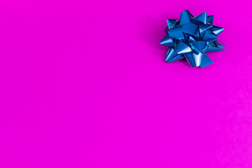 Blank Neon magenta paper with blue bow