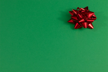 Festive green blank paper with red bow