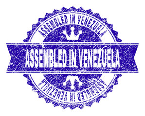 Obraz premium ASSEMBLED IN VENEZUELA rosette seal imprint with distress texture. Designed with round rosette, ribbon and small crowns. Blue vector rubber watermark of ASSEMBLED IN VENEZUELA text with dirty texture.