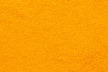 Keuken spatwand met foto curcuma turmeric spice powder full frame smooth surface © orinocoArt
