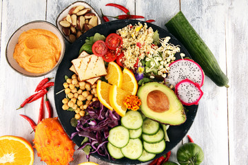grilled tofu and dragon fruit buddha bowl with vegetable and humus