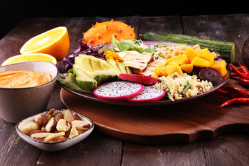 grilled tofu and dragon fruit buddha bowl with vegetable and humus