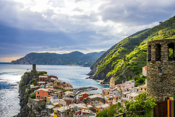 beach streets and colorful houses on the hill in Vernazza in Cinque Terre in Italy 
