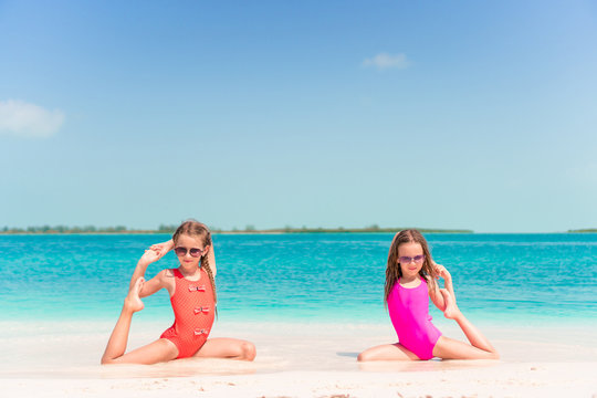 Adorable little girls during summer tropical vacation