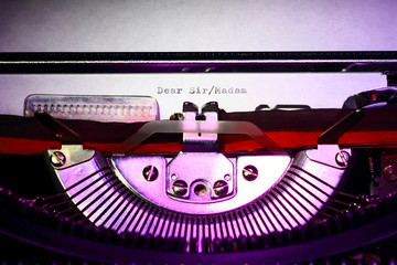 Vintage typewriter with the words dear sir/madam printed on a letter
