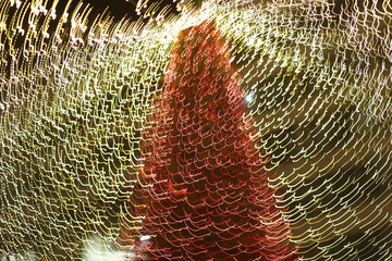 Varied whirling lights on Christmas tree as artistic effects