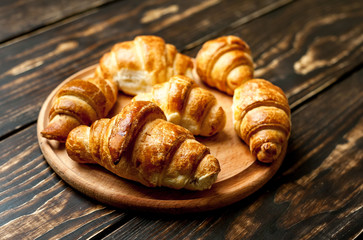 croissants on wooden background