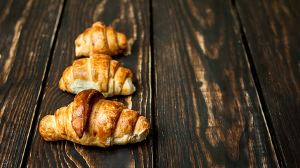 croissants on wooden background