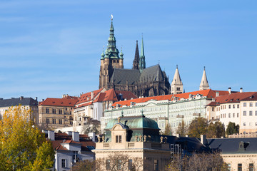 Colorful autumn Prague gothic Castle with the Lesser Town above River Vltava in the sunny Day, Czech Republic