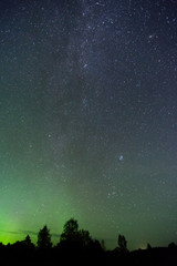 Fototapeta na wymiar Night sky with Aurora Borealis