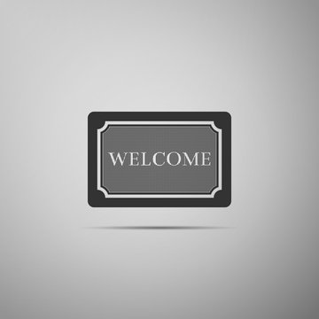 Doormat with the text Welcome icon isolated on grey background. Welcome mat sign. Flat design. Vector Illustration