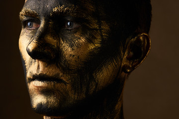 Hard Work Concept. Coal and Gold Miner, dirty worker against dar