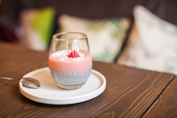 Chia pudding in glass with fresh berry. Superfoods healthy breakfast concept