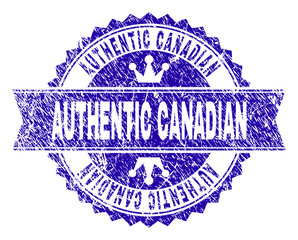 Obraz premium AUTHENTIC CANADIAN rosette seal imitation with grunge style. Designed with round rosette, ribbon and small crowns. Blue vector rubber watermark of AUTHENTIC CANADIAN tag with grunge style.