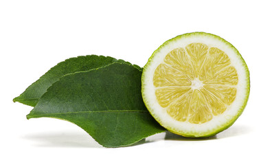 Fototapeta na wymiar Half lemon fruit with two leaves on the side