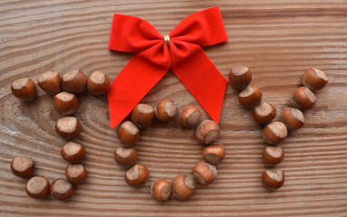 JOY spelled with hazelnut with a red bow
