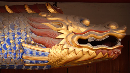 Buddhist symbolic animal with a golden fish head looking like a dragon in a temple in China, Asia