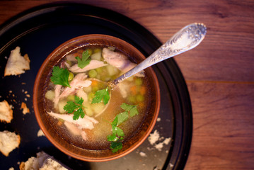 Appetizing soup with chicken fillet and green peas. The first hot dish.
