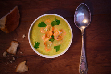 Delicious soup of mashed vegetables and shrimps with chicken. The first hot dish.