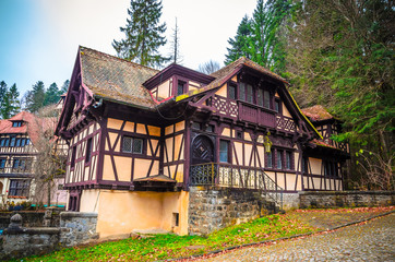 Fototapeta na wymiar Typical houses near Peles castle in the city Sinaia, Carpathian Mountains, Romania