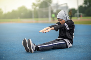 Fototapeta premium Asian couple at track stadium exercising for healthy lifestyle