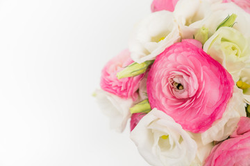 Pinc Ranunculus and White Lisianthus on white background with copy space