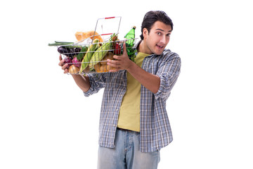 Young man with his grocery shopping on white