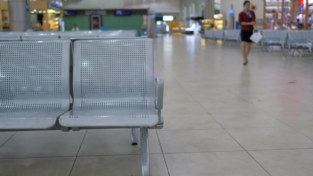 Nobody on waiting chairs zone in airport, bus station. Royalty high-quality free stock video footage of bench and chair in the terminal of airport, waiting area with chairs empty and no one or nobody