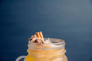 Icy cold mandarin beverage on the rustic background. Selective focus. Shallow depth of field.