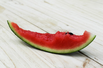 Fototapeta na wymiar Watermelon to eat on wooden table backgrounds