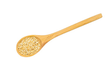 Wooden spoon with quinoa seeds isolated on white background.