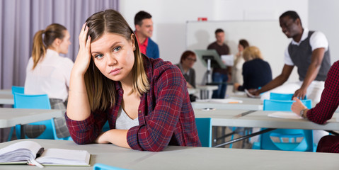 Upset girl in auditorium