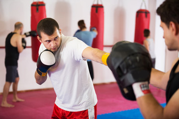 Sportsmen competing in boxing gloves
