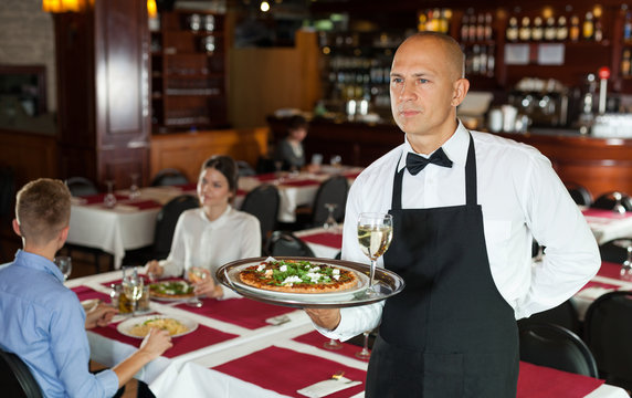 Waiter with serving tray