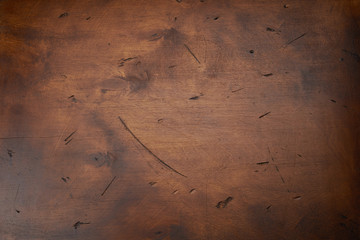 Scratched dark wood texture as background. Texture with cracks and stain
