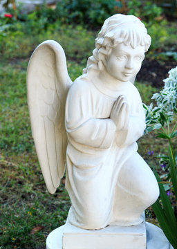 wonderful Sculpture of a prayer angel. architecture, statue, archetype, religion,