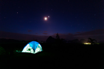 Tourist tent camping on top of mountains overlooking landscape scenery view