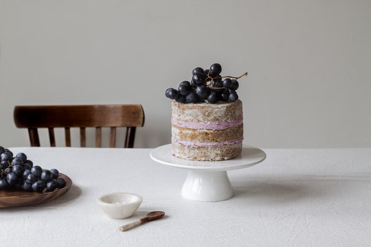 black grapes layered cake with fresh produce on the table 