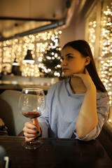 The girl in the evening rest in a cafe