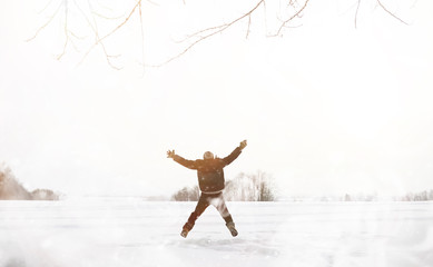 Fototapeta na wymiar A man on a walk. Winter landscape. Tourist in winter journey.