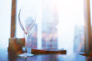 Cocktail glasses on the windowsill by the glass