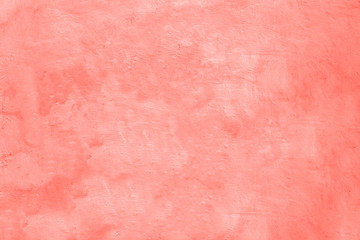 Living coral colored concrete background texture, color of year 2019.