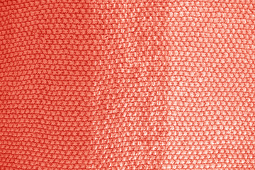 Knitted texture in Living Coral color of 2019.