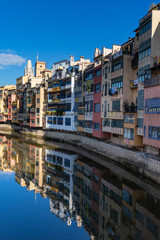 Girona landmark in Catalonia. Urban scene of river facade houses and water reflection